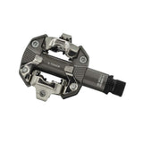 Look X-Track MTB pedals in metallic grey with SPD compatibility and adjustable tension, designed for mountain biking components.