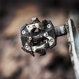 Look X-Track Race Carbon Ti MTB pedals with adjustable SPD cleat tension, featuring lightweight carbon and titanium construction.