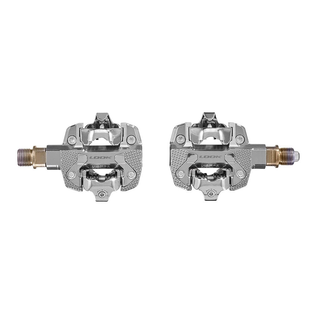 Look X-Track Power single MTB and gravel pedals with integrated power meter, showing sleek design and pedal cleats.