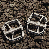 Look Trail Roc Plus flat pedals with forged aluminum platform and adjustable pins, designed for durable mountain biking components.