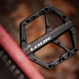 Look Trail Roc flat mountain biking pedals with traction pins, durable components for improved grip and performance.