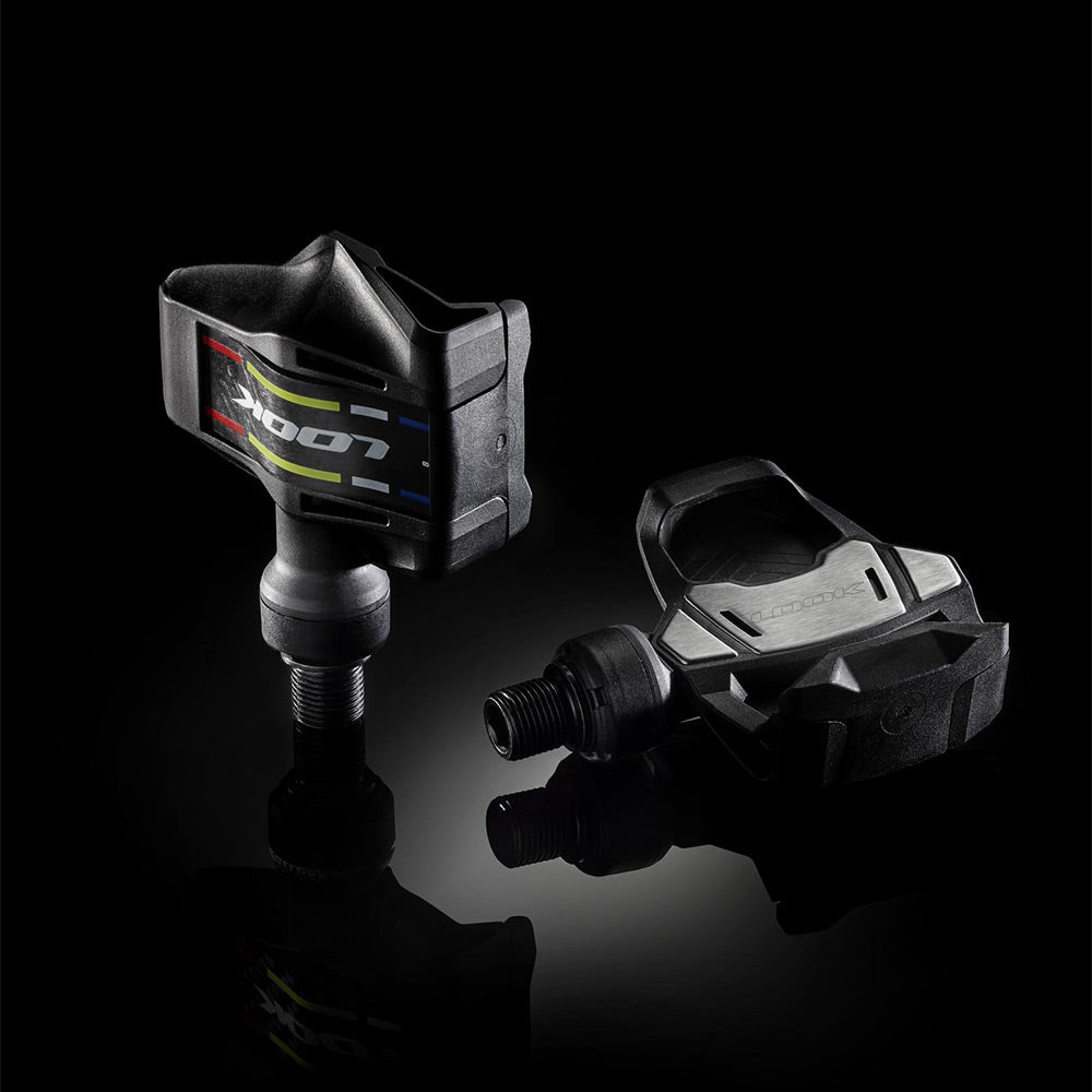 Look Keo Blade road bike pedals with aerodynamic design and wide platform, showcasing lightweight components for cycling performance.