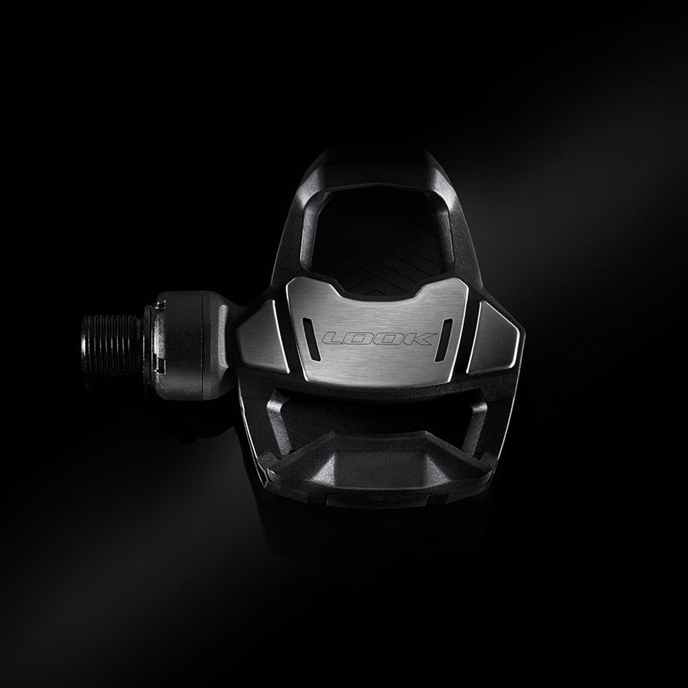 Look Keo Blade road bike pedals with aerodynamic design and wide platform, showcasing sleek black components and secure clipless mechanism.
