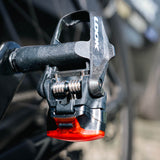 Look Keo Blade Ceramic 12 Vision Road Pedals with integrated safety lighting, showing sleek black pedals with reflective accents.