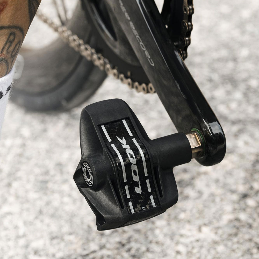 Look Keo Blade Power dual pedals with integrated power meter and Bluetooth connectivity, shown mounted on cycling shoes.