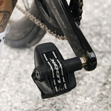 Look Keo Blade Power dual pedals with integrated power meter and Bluetooth connectivity, shown mounted on cycling shoes.