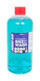 Morgan Blue Bike Wash cleaner in a workshop setting, showing the bottle of gentle lubrication and protective bike soap.