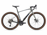 Giant Revolt Advanced 0 gravel bike with adjustable wheelbase and integrated storage, featuring a sleek frame and knobby tires.