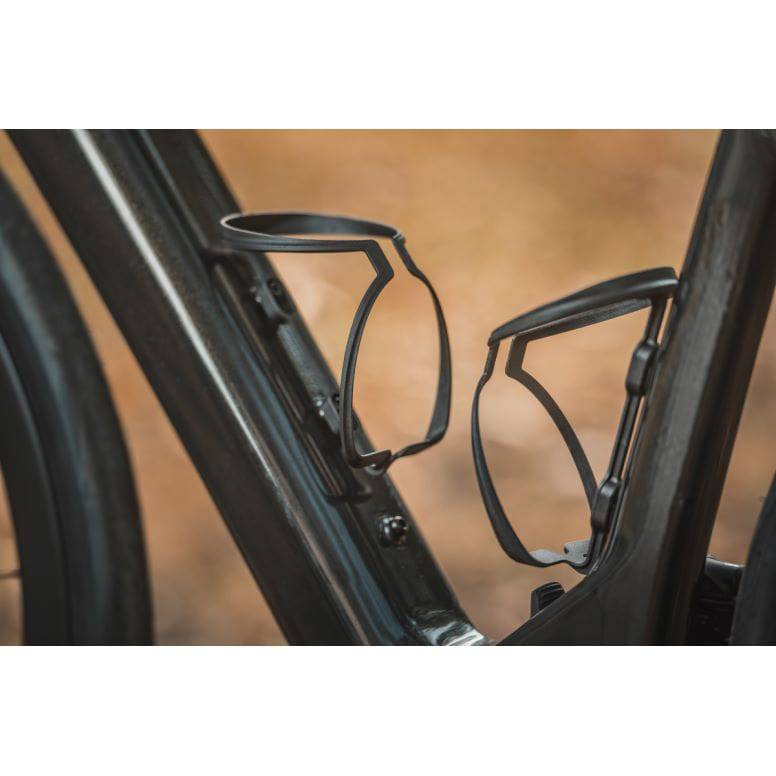 Topeak Feza Cage V1 black carbon fiber bike water bottle cage holder mounted on a bicycle frame