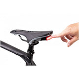 Topeak Redlite 30 Black USB rechargeable rear bike light with 30 lumens, waterproof IPX6, mounted on a bicycle.