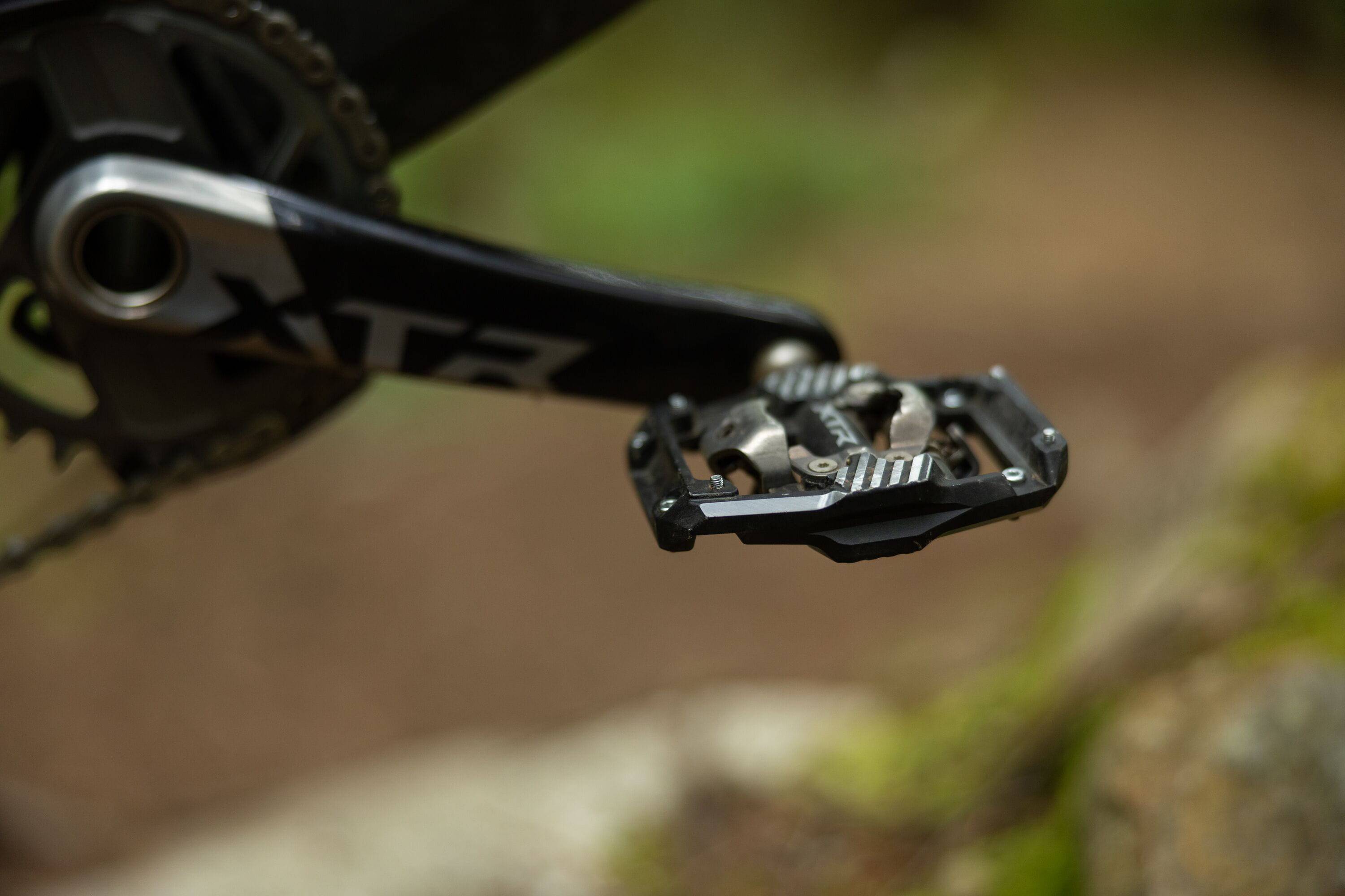 Shimano XTR PD-M9220 Trail Wide Platform Pedals for mountain biking, showing their durable design and wide pedal surface.