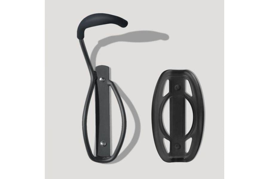 Black Delta bike hook with tray for wall-mounted bike storage, vertical wall mount accessory for secure bike organization.