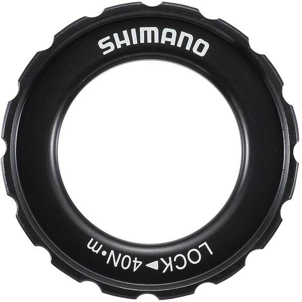 Shimano Spares HB-M618 lock ring and washer for hub assembly maintenance, shown in close-up on a bicycle hub.