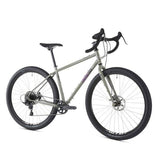 Genesis Vagabond gravel bike with 29-inch wheels and Sram Apex drivetrain, ideal for touring and commuting on rugged terrain.