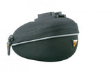 Topeak Propack lightweight bike seat pack with quick release strap and reflective piping attached to a bike saddle.