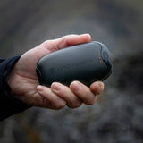 Lifesystems rechargeable dual palm handwarmer with adjustable heat settings and built-in power bank, designed for outdoor warmth.