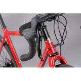 Genesis Equilibrium disc road bike with Shimano 105 R7000 components and rack mounts for versatile cycling.