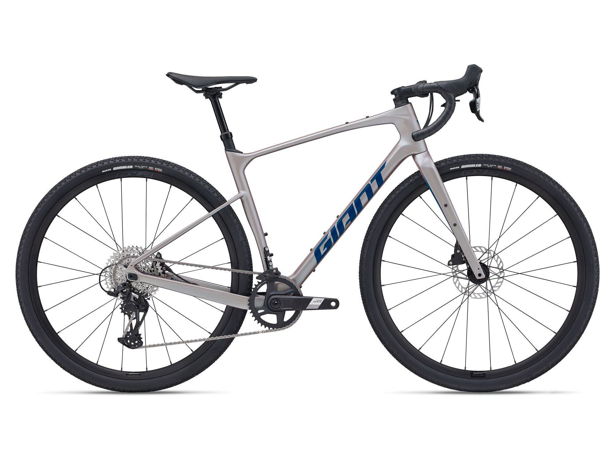 Giant Revolt Advanced 1 2024 gravel bike with SRAM Apex groupset and disc brakes, shown from a side angle on a trail.