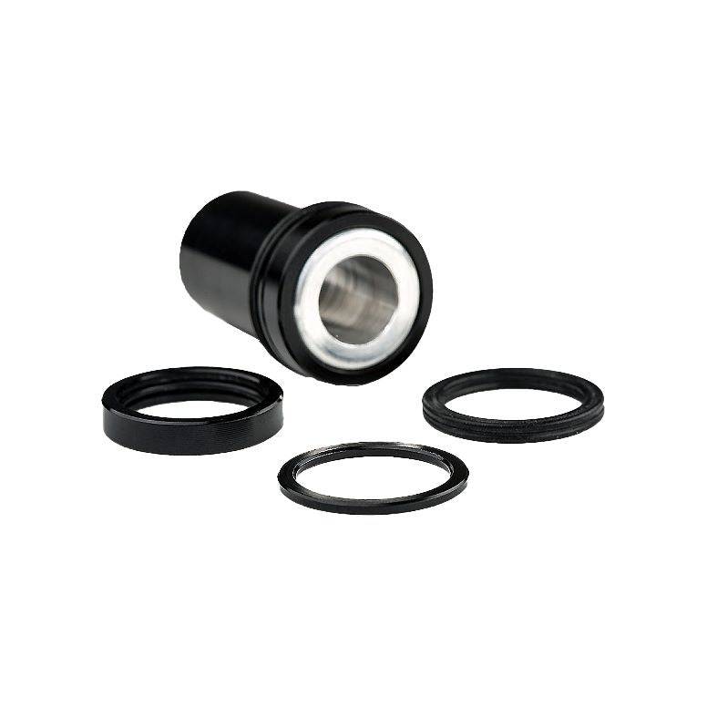 Cane Creek 50x10mm mounting hardware for TREK offset Double Barrel shock, black, close-up of component for mountain bike suspension