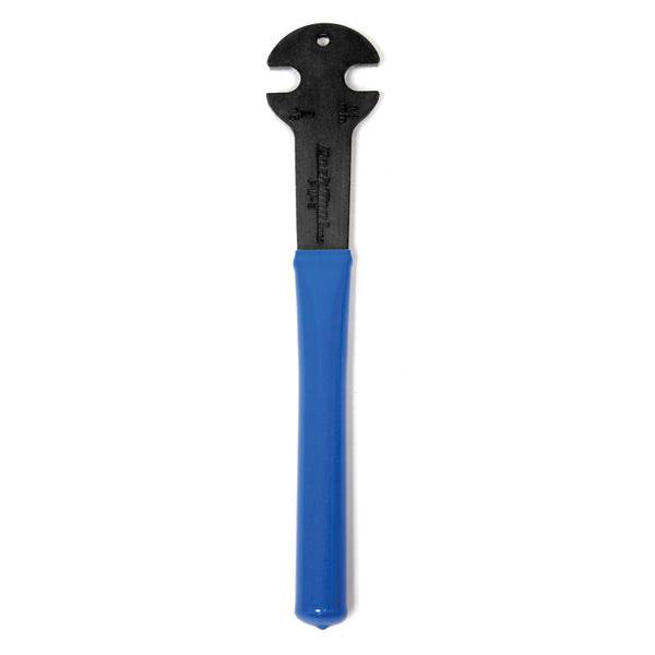Park Tool PW-3 pedal wrench with dual 15mm and 9/16 ends for bike maintenance, shown in a workshop setting