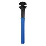 Park Tool PW-3 pedal wrench with dual 15mm and 9/16 ends for bike maintenance, shown in a workshop setting
