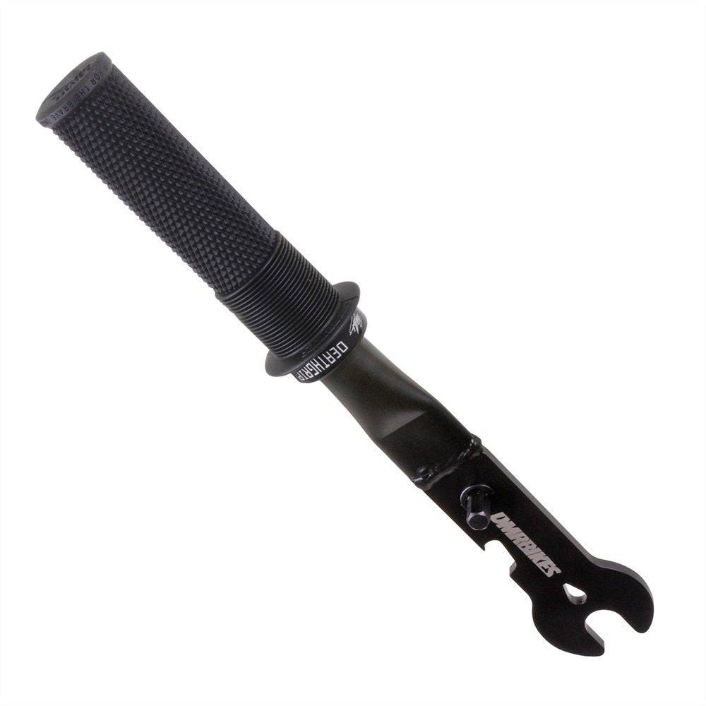 DMR Bikes pedal spanner tool with 15mm wrench and deathgrip handle for bike maintenance, shown in a workshop setting