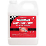 Finish Line Dry Chain Lube Teflon Plus synthetic bike lubricant applied to a bike chain for smooth drivetrain performance.
