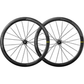 Mavic Cosmic Ultimate 45 Disc road wheelset with aerodynamic carbon tubeless rims and black spokes on a road bike.