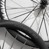 Mavic Comete 50 ceramic bearing carbon disc wheelset for road bikes, showing aerodynamic black carbon wheels with disc brakes.