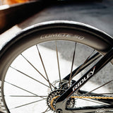 Mavic Comete 50 ceramic bearing carbon disc wheelset for road bikes, showing lightweight aerodynamic design and sleek black finish.