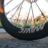 Mavic Comete 50 ceramic bearing carbon disc wheelset for road bikes, showing aerodynamic rims and high-performance components.
