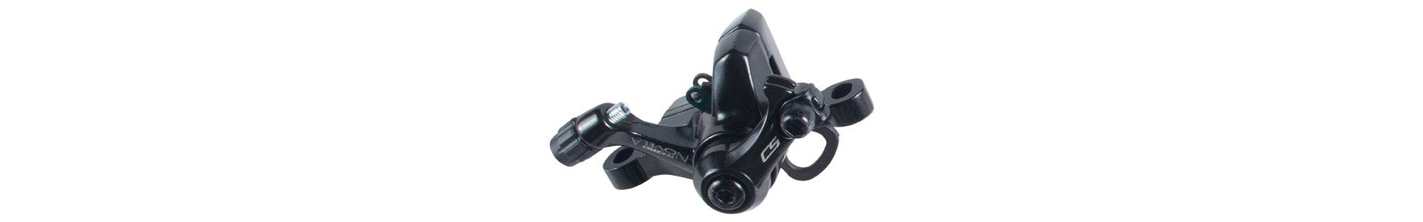 Black Tektro Novela mechanical disc brake calipers for Trek bikes, front and rear, shown without levers on a bicycle component image.