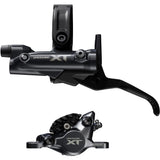 Shimano Deore XT M8200 brake lever and post mount caliper set for mountain biking, black finish, mounted on a bike.