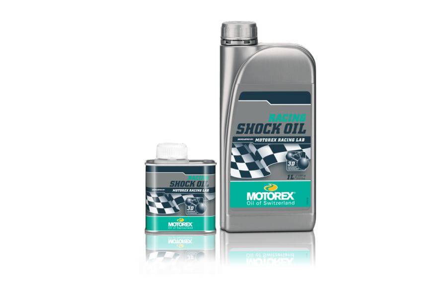 Motorex Racing Shock Oil in green and silver bottle, 1 liter, designed for high-performance motorcycle suspension systems.