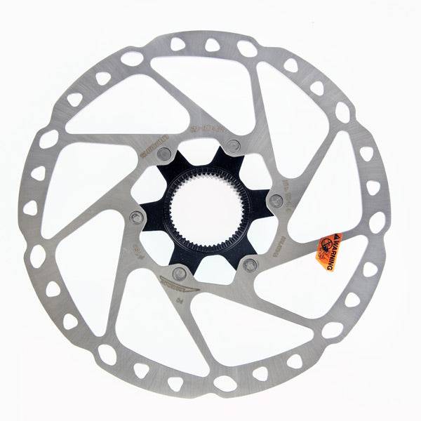 Shimano Deore SM-RT64 centre-lock disc brake rotor for reliable cycling performance, showing a silver metal rotor with mounting holes.