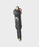 Marzocchi Bomber Inline rear shock for trail bikes, showing the shock absorber with mounting hardware and branding.