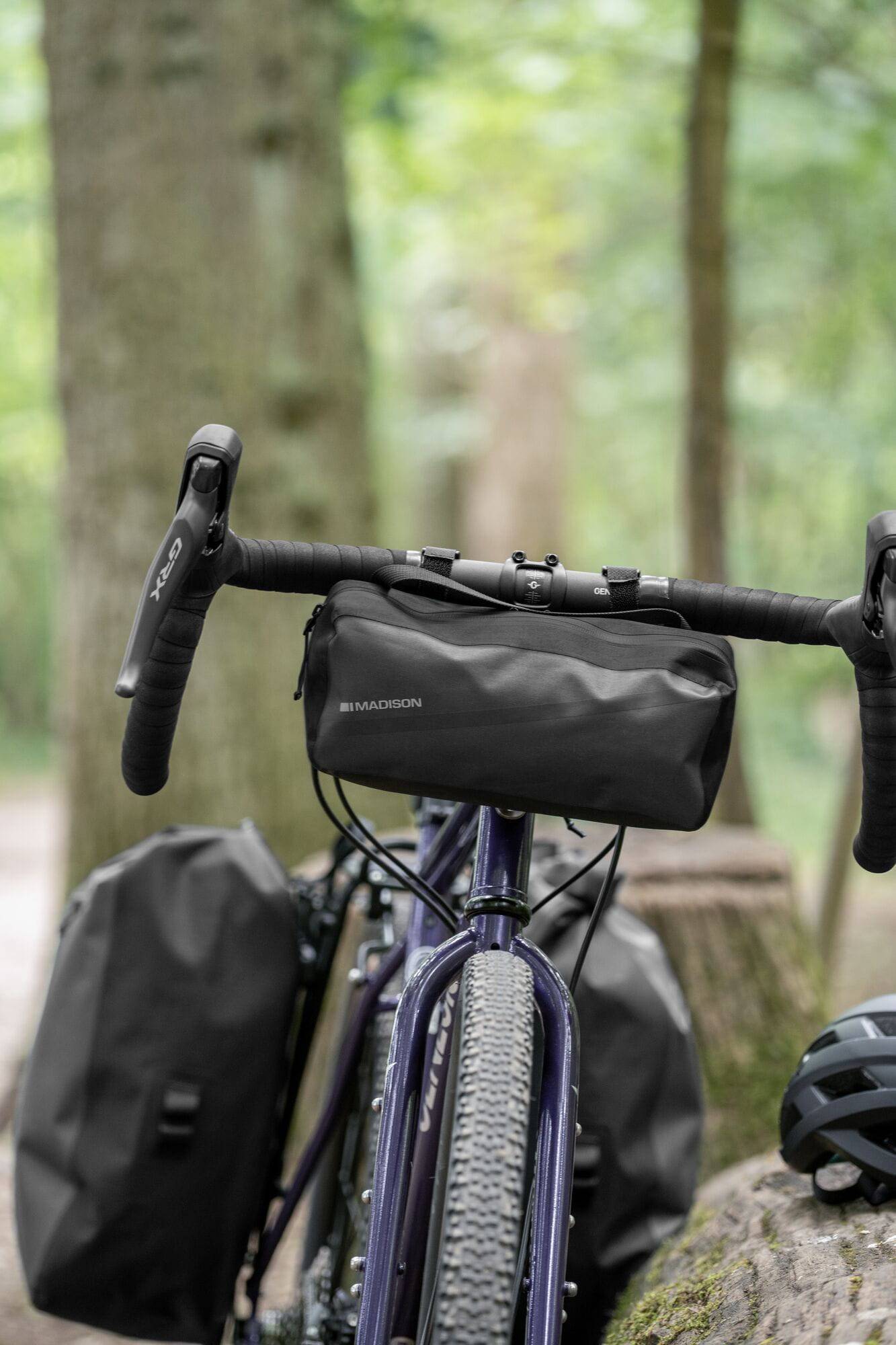 Madison Bags Roam waterproof handlebar bag with elastic strap mount and reflective trim, cycling accessories for bike storage.