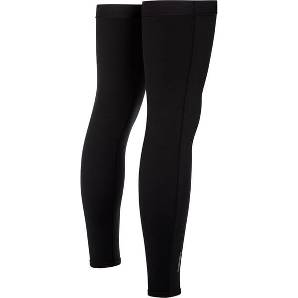 Madison DTE Isoler thermal leg warmers with water-resistant coating, shown in a natural outdoor setting, designed for cold weather.