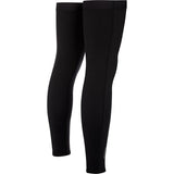 Madison DTE Isoler thermal leg warmers with water-resistant coating, shown in a natural outdoor setting, designed for cold weather.