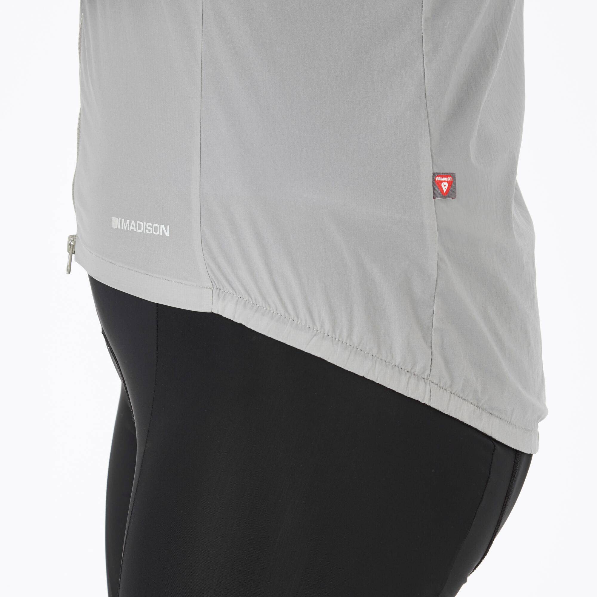 Madison Roam women's windproof packable Primaloft insulated gilet vest hanging on a rack, showcasing its lightweight design and quilting