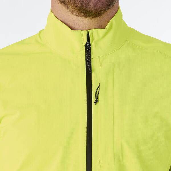 Madison men's waterproof cycling jacket with reflective safety features, shown in a close-up of the navy blue jacket's front.
