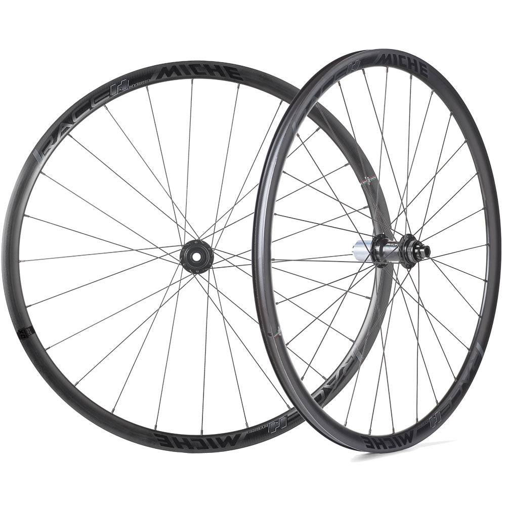 Miche Race H disc brake road wheels, tubeless-ready components for hybrid and e-bikes, featuring sleek black alloy rims and disc brake compatibility.