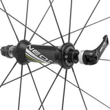 Miche Neon Black on Black road wheel with tubeless-ready, aerodynamic design, showcasing sleek, lightweight component for cycling.