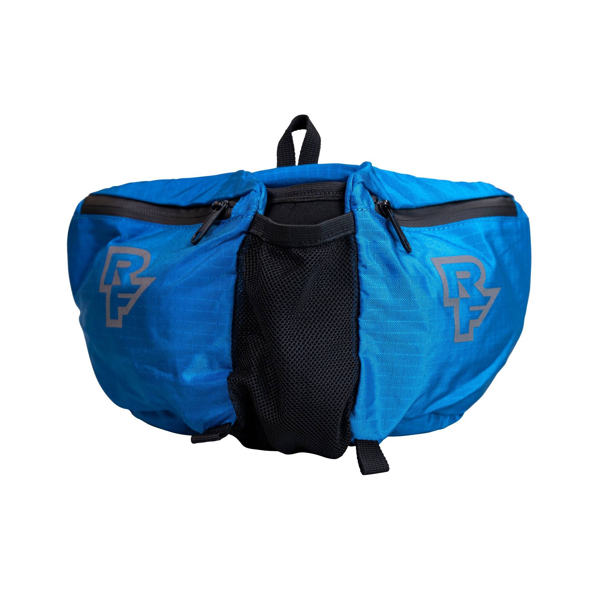 Race Face Stash Quick Rip Hydration Bag with bike storage pockets and safety features for cycling adventures.