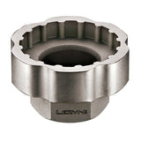 Lezyne external bottom bracket socket tool for 3/8-inch drive, suitable for bike workshop maintenance, shown on a workbench.