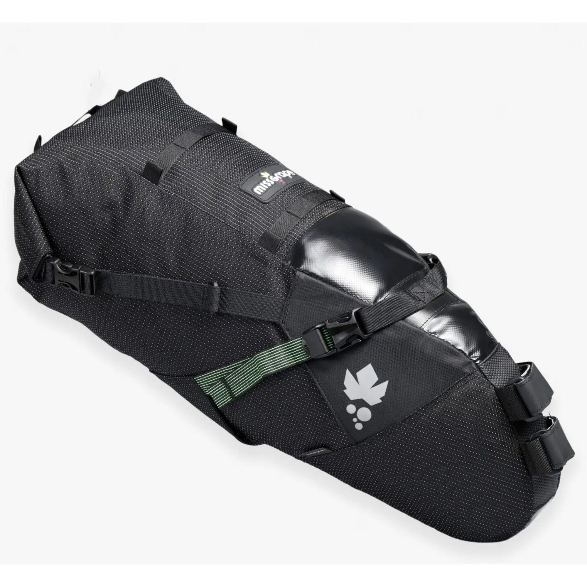 Miss Grape Cluster 20 Adventure waterproof saddle bag attached to bike saddle for bikepacking, featuring durable outdoor gear design.