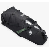 Miss Grape Cluster 20 Adventure waterproof saddle bag attached to bike saddle for bikepacking, featuring durable outdoor gear design.