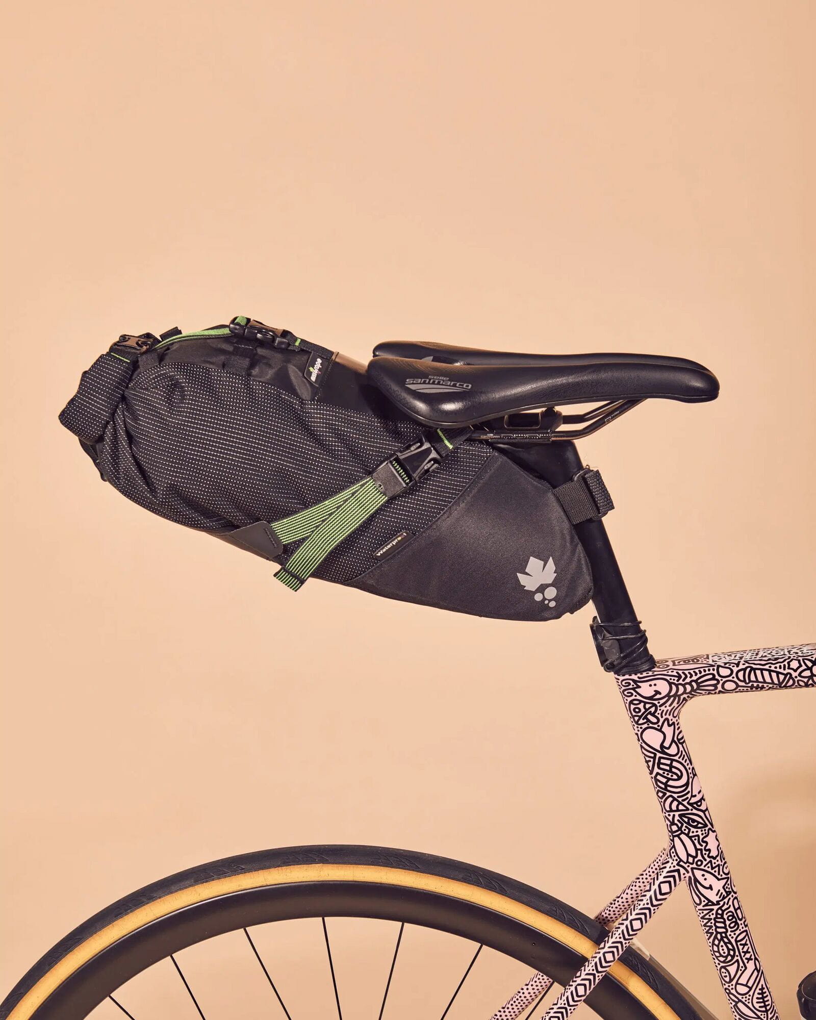 Miss Grape Cluster 7L waterproof road and gravel bike saddle bag attached to bike seat, designed for bike accessories storage.