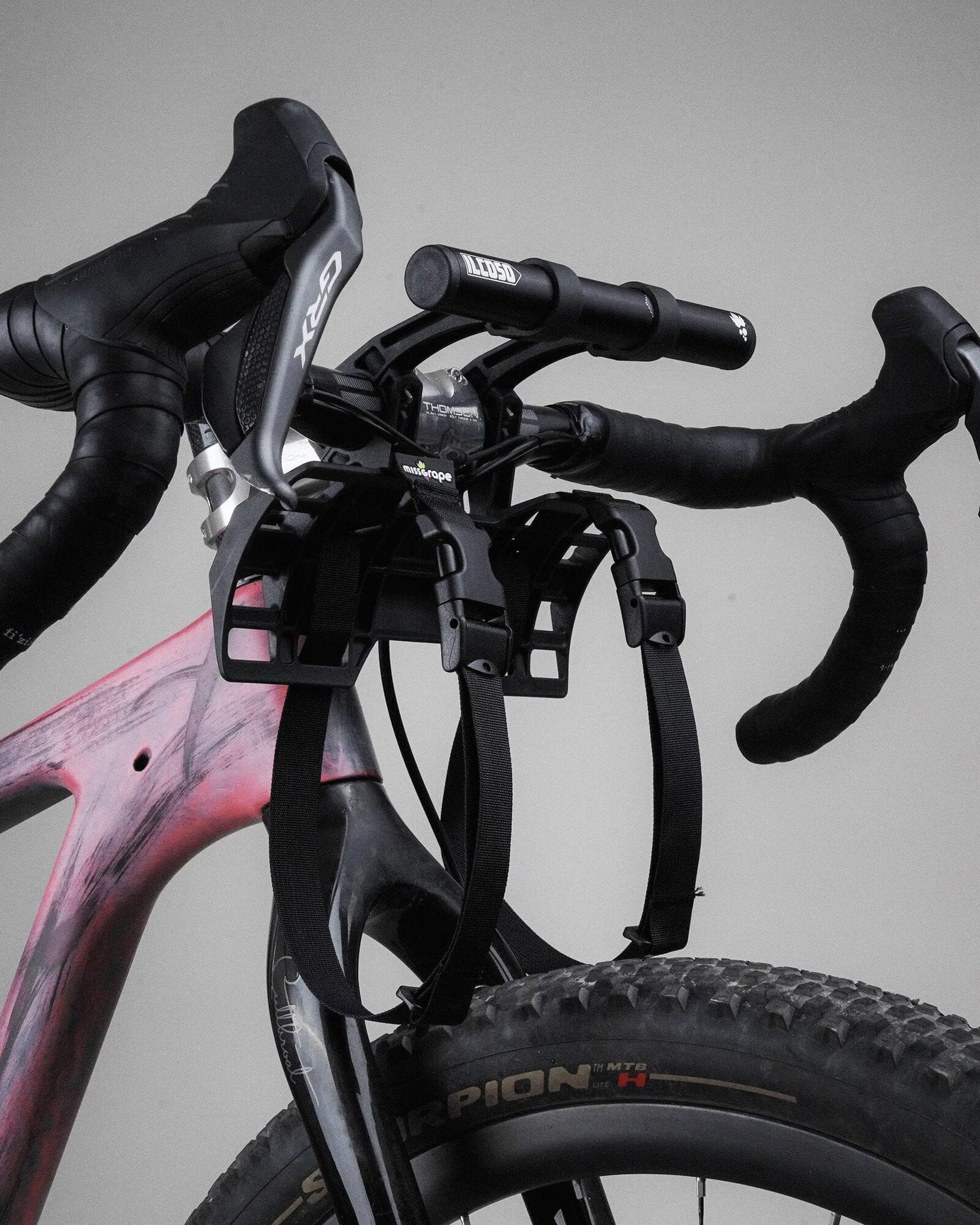 Miss Grape ILCOSO handlebar mount system for bikepacking and front luggage, shown attached to a bike handlebar.