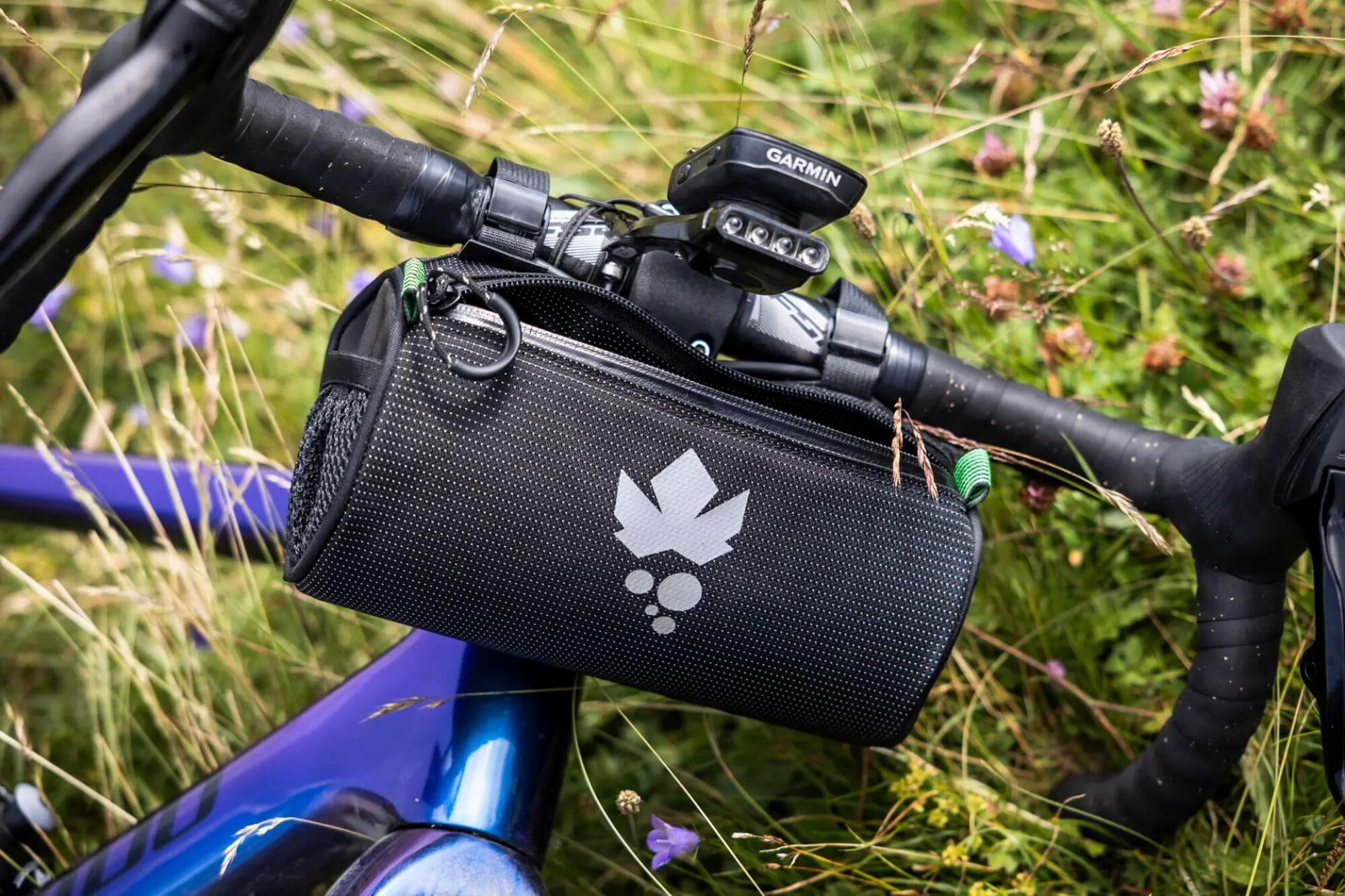 Miss Grape Moon Commute handlebar bag for road and gravel bikes, water-resistant cycling accessory with secure mounting.